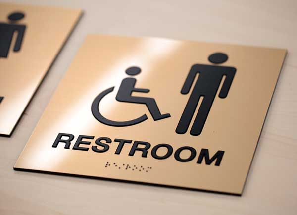 Restroom wayfinding sign